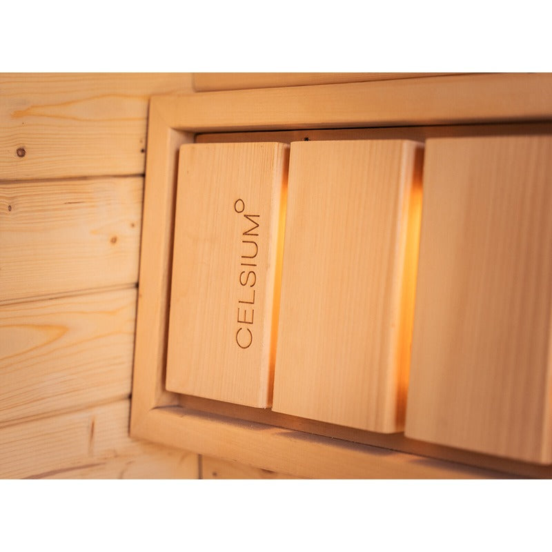 Detailed view of the Celsium Ula Small sauna with integrated wooden panel and soft backlighting - high-quality interior finish with Celsium branding