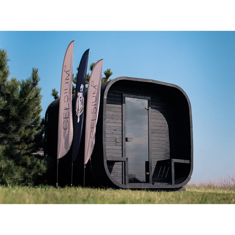 Celsium Ula Small outdoor sauna in Shou Sugi Ban black with covered entrance area and glass front - premium outdoor design sauna with Celsium branding